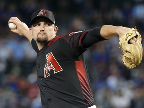 Arizona Diamondbacks starting pitcher Zack Godley throws against the Chicago Cubs during the first inning of a baseball game, Saturday, April 27, 2019, in Phoenix.