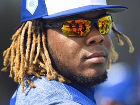 Toronto Blue Jays infielder Vladimir Guerrero Jr. (27) looks on at practice during baseball spring training in Dunedin, Fla., on Monday, February 18, 2019.