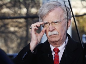 FILE - In this March 5, 2019, file photo, U.S. national security adviser John Bolton adjusts his glasses before an interview at the White House in Washington. North Korea has issued a relatively mild criticism of White House national security adviser John Bolton over a recent interview he gave. State media on Saturday cited First Vice Foreign Minister Choe Son Hui as criticizing Bolton for telling Bloomberg News that the U.S. would need more evidence of North Korea's disarmament commitment before a third leaders' summit.