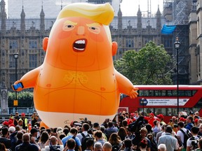 The 'Trump Baby' blimp, a six metre-high helium-filled effigy of U.S. President Donald Trump, lifts off from Parliament Square in London, U.K., on Friday, July 13, 2018.
