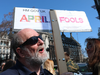 A protester holds a sign outside the Houses of Parliament in London on April 1, 2019.