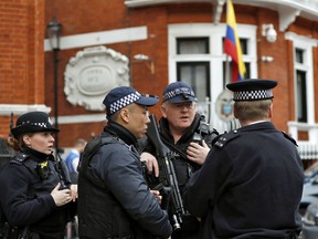 Armed police arrive outside the Ecuadorian Embassy, in London, on Friday, April 5, 2019, where Wikileaks founder Julian Assange has been holed up since 2012.