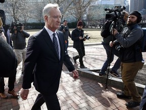 FILE - In this April 3, 2019 file photo, TobyMacFarlane departs federal court in Boston after facing charges in a nationwide college admissions bribery scandal. Authorities said Tuesday, April 23, that MacFarlane, a former senior executive at a title insurance company, will plead guilty to racketeering conspiracy and cooperate with federal authorities in the case.