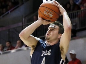 FILE - In this Nov. 22, 2015 file photo, Yale's Jack Montague attempts a shot during an NCAA college basketball game against SMU in Dallas. Yale expelled Montague in February 2016 because of a sexual assault allegation. A federal judge ruled Monday, April 1, 2019, that the former basketball captain can move forward with his lawsuit against the university.