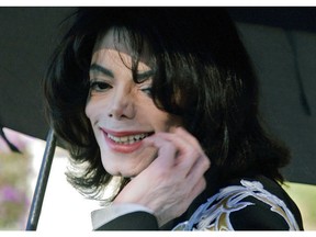 FILE - In this Dec. 17, 2004, file photo, pop star Michael Jackson gestures after greeting several hundred children who were invited guests at his Neverland Ranch home in Santa Ynez, Calif. The co-executor of Jackson's estate says he's confident the late superstar's supporters will be able to protect his legacy and brand in the wake of HBO's "Leaving Neverland," a documentary detailing allegations of sexual abuse.