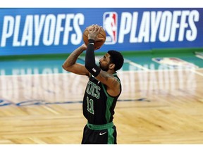 Boston Celtics' Kyrie Irving shoots against the Indiana Pacers during the first quarter in Game 1 of a first-round NBA basketball playoff series, Sunday, April 14, 2019, in Boston.