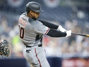 Arizona Diamondbacks' Adam Jones hits a solo home run during the first inning of a baseball game against the San Diego Padres in San Diego, Monday, April 1, 2019.