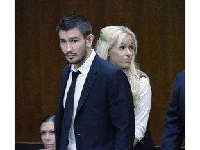 FILE - In this July 2, 2015, file photo, Los Angeles Kings' Slava Voynov enters Superior Court with his wife, Marta Varlamova, in Torrance, Calif. The NHL has suspended defenseman Slava Voynov for the 2019-20 season and 2020 playoffs for domestic violence. Commissioner Gary Bettman suspended Voynov on Tuesday, April 9, 2019, for what the league called unacceptable off-ice conduct. The 29-year-old Russian could have his eligibility to restored July 1, 2020, based on good behavior. Voynov was suspended indefinitely in October 2014 after being arrested for domestic abuse. He pleaded no contest to a misdemeanor, left the United States to go back to Russia and in July had the conviction dismissed by a judge in Los Angeles county.