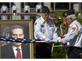 Members of Newport Harbor American Legion Post 291 fold the flag before presenting it to the grandchildren of Edward Nixon in Yorba Linda, Calif., Sunday, April 14, 2019. Nixon, who died on Feb. 27, was last surviving brother of President Richard Nixon.