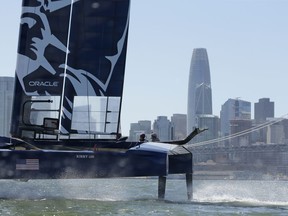 The U.S. team F50 foiling catamaran trains after its launch Monday, April 22, 2019, in San Francisco. New global sports league SailGP launched the first of six F50 race boats into San Francisco Bay that will compete May 4-5. The 50-foot long catamaran is capable of hitting speeds of 60 miles per hour. In the background is the Salesforce Tower.