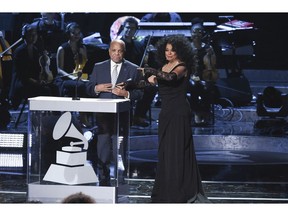 FILE - In this Tuesday, Feb.12, 2019 file photo, Berry Gordy, left, and Diana Ross speak onstage during Motown 60: A GRAMMY Celebration at the Microsoft Theater in Los Angeles. Gordy says his historic label brought people from all walks of life through a "legacy of love" at the "Motown 60: A Grammy Celebration" during a taped tribute that will air April 21 on CBS.