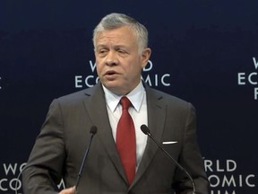 King Abdullah II of Jordan addresses the audience at the World Economic Forum at Dead Sea, Jordan on Saturday, April 6, 2019.  During the forum Saturday,  Oman's foreign minister has called on Palestinians to reassure Israel that it's not under threat in the Middle East, drawing a sharp public rebuke from his Jordanian counterpart. Unlike Jordan, Oman doesn't have formal relations with Israel, but mutual ties are rapidly warming. (WEF via AP, Pool)