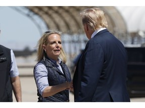 President Donald Trump greets Homeland Security Secretary Kirstjen Nielsen after he arrived on Air Force One at Naval Air Facility El Centro, in El Centro, Calif., Friday April 5, 2019.