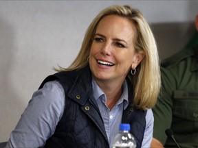 Homeland Security Secretary Kirstjen Nielsen listens to President Donald Trump at a roundtable on immigration and border security at the U.S. Border Patrol Calexico Station in Calexico, Calif., Friday April 5, 2019. Trump headed to the border with Mexico to make a renewed push for border security as a central campaign issue for his 2020 re-election.