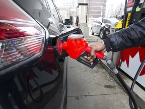 A Toronto motorist fills up on April 1, 2019. Prices have risen at the pumps since the introduction of the Trudeau government's federal carbon tax.