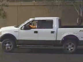 This photo provided by the Phoenix Police Department shows a security video photo of what is believed to be the suspects vehicle in a road rage incident in Phoenix, Ariz. where a 10 year old girl was fatally shot. Sgt. Vince Lewis said the shooting that killed Summerbell Brown occurred Wednesday, April 3, 2019 when a man in a pickup truck that had been following a family's car fired several gunshots after the family pulled into their driveway. (Phoenix Police Department via AP)