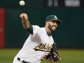 Oakland Athletics starting pitcher Mike Fiers (50) throws against the Boston Red Sox during the first inning of a baseball game in Oakland, Calif., Tuesday, April 2, 2019.