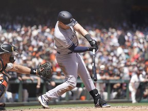 New York Yankees' Luke Voit hits a single to drive in two runs against the San Francisco Giants during the second inning of a baseball game Sunday, April 28, 2019, in San Francisco.