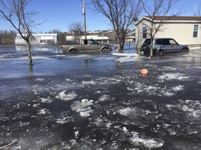 This March 2019 photo provided by Henry Red Cloud, shows flooding on Cloud's Lakota Solar Enterprises property on the Pine Ridge Reservation in southern South Dakota. Red Cloud estimates flood damage at $250,000. Plains and Midwest states are bracing for another massive winter storm Wednesday and Thursday and the prospect of renewed flooding when the snow melts.