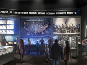 This artist's rendering provided by the United States Marshals Museum Friday, April 26, 2019, depicts a proposed exhibit showing the work U.S. Marshals do today at a future museum in Fort Smith, Arkansas. The $50 million museum dedicated to the U.S. Marshals is about $15 million under-funded, and the museum's foundation recently announced a crowdfunding effort to raise money. Though the building will be dedicated in September as originally planned, the museum's opening has been pushed back to sometime next year. (United States Marshals Museum via AP)