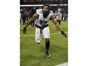 FILE - In this Jan. 6, 2019, file photo, Philadelphia Eagles defensive end Michael Bennett (77) celebrates after an NFL wild-card playoff football game in Chicago. Prosecutors in Texas are dismissing a felony charge against NFL defensive end Michael Bennett, who was accused of pushing the arm of a paraplegic security guard while trying to get onto the field after the 2017 Super Bowl in Houston. The Harris County district attorney's office announced the decision Wednesday, April 3, 2019.