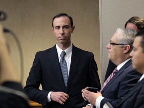 FILE - In this Feb. 7, 2019 file photo, Secretary of State David Whitley, left, arrives for his confirmation hearing in Austin, Texas. Texas has settled a federal lawsuit over the state's bungled search for non-citizens among the state's 16 million registered voters. The agreement announced Friday, April 26, 2019 ends an effort by Texas elections officials that led to the state wrongly questioning the U.S. citizenship of tens of thousands of voters. Whitley said the agreement allows the state to continue "voter registration list maintenance" but ensures that the same mistakes won't happen again.