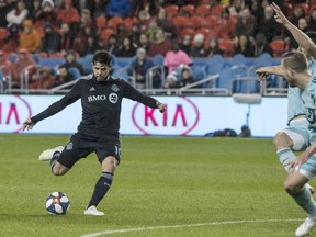Toronto FC midfielder Alejandro Pozuelo (10) scores on the Minnesota United during first half MLS soccer action in Toronto on Friday, April 19, 2019.