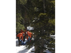 Members of an Alpine Rescue Team carry out the body of 18-year-old Sol Pais, near Echo Lake Campground in Arapaho National Forest, Wednesday, April 17, 2019 in Idaho Springs, Colo. The young Florida woman who authorities say was so "infatuated" with the Columbine school shooting they feared she was planning an attack in Colorado just days ahead of the 20th anniversary was found dead Wednesday in an apparent suicide after a nearly 24-hour manhunt.