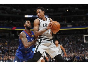 Denver Nuggets guard Will Barton, left, defends against San Antonio Spurs guard DeMar DeRozan during the first half of Game 1 of an NBA first-round basketball playoff series Saturday, April 13, 2019, in Denver.