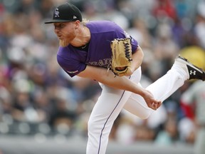 Colorado Rockies starting pitcher Jon Gray works against the Philadelphia Phillies in the first inning of a baseball game Sunday, April 21, 2019, in Denver.