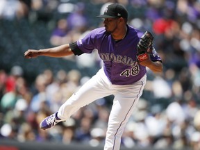 Colorado Rockies starting pitcher German Marquez works against the Washington Nationals in the first inning of a baseball game Wednesday, April 24, 2019, in Denver.