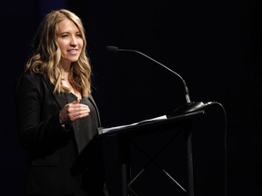 Crystal Woodman-Miller, who was a student at Columbine High School during the massacre nearly 20 years earlier, speaks during a faith-based memorial service for the victims at a community church, Thursday, April 18, 2019, in Littleton, Colo.