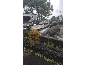 Cyclone damaged cars in Moroni, Comoros, Thursday, April 25, 2019 after Cyclone Kenneth hit the island nation of Comoros. The powerful tropical cyclone is expected to make landfall by early Friday in northern Mozambique, just six weeks after Cyclone Idai devastated the central part of the country and left hundreds dead.