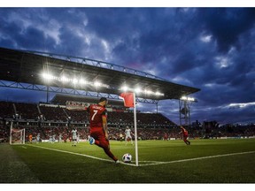 Toronto FC's Victor Vazquez takes a corner kick against the Chicago Fire during the second half of MLS soccer action in Toronto on July 28, 2018. The much-maligned grass at BMO Field is getting a helping hand. Synthetic strands are being stitched in to produce a stronger, more durable playing surface.