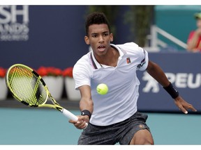 Canada's Felix Auger-Aliassime returns to John Isner during their semifinal match at the Miami Open tennis tournament, Friday, March 29, 2019, in Miami Gardens, Fla. Canada's newest tennis star is being described as a mature and passionate young man - and someone who has what it takes to dominate at the sport's highest level.