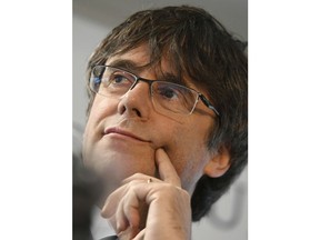 Former Catalan leader Carles Puigdemont speaks as he presents his candidacy for the European elections during a media conference in Brussels, Wednesday, April 10, 2019. A Quebec nationalist group is claiming the Canadian government revoked a travel permit for the exiled former president of Spain's Catalonia region.