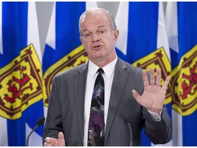 Nova Scotia Justice Minister Mark Furey fields question as he holds a bill briefing on the Cannabis Control Act in Halifax on Tuesday, April 3, 2018. Furey is ordering a moratorium on street checks of pedestrians by police across the province.THE CANADIAN PRESS/Andrew Vaughan