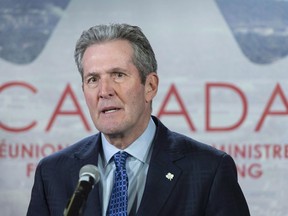 The Manitoba government is launching a review of how Winnipeg city hall approves and inspects construction projects and property development. Manitoba Premier Brian Pallister responds to questions during a news conference at the first ministers meeting in Montreal, Friday, Dec. 7, 2018.