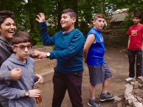 A scene from the Barbara Kopple-directed documentary "New Homeland," which follows refugee boys at Camp Pathfinder in Algonquin Park is shown in a handout photo. THE CANADIAN PRESS/HO-Cabin Creek Films MANDATORY CREDIT