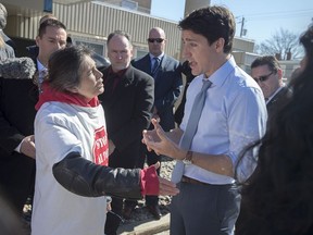 Prime Minister Justin Trudeau talks with Darlene Gilbert, a Mi'kmaq water protector, about the plan by Alton Gas to dump massive amount of brine into a local river as they create salt caverns in which to store natural gas, as he visits the Northwood seniors' residence in Halifax on \March 28, 2019. Three Indigenous women described as "grassroots grandmothers'' who were arrested last week at a rural construction site north of Halifax have filed a title claim over land where a company plans to build a natural gas storage facility. Their lawyer, Michael McDonald, told the Nova Scotia Supreme Court today that the claim is based on the 1752 treaty with the Crown and the notice of motion is for an aboriginal title claim for the lands currently being used by Alton Gas.