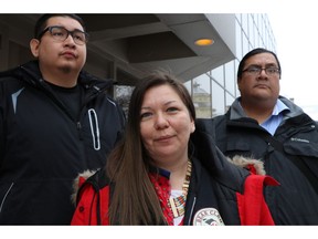 Melissa Stevenson, centre, stands outside the Winnipeg courthouse with Henry McKay, left, and Travis Bighetty after Christopher Brass was sentenced to 15 years for manslaughter in the shooting death of Stevenson's best friend, 29-year-old Jeanenne Fontaine, on Wednesday, Jan. 23, 2019. The best friend of a Manitoba Indigenous woman killed during a botched robbery looked at a man guilty in the killing and asked how a life could be worth only $45.