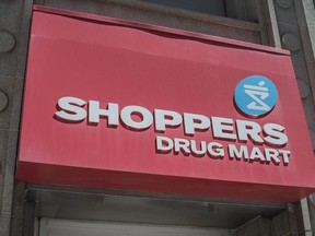 The logo for Shoppers Drug Mart is shown in downtown Toronto on May 24, 2016. Medical cannabis users in Alberta can now get their therapeutic pot from Shoppers Drug Mart, with the retail giant opening its second online platform Tuesday in the western province as it pursues the growing market.