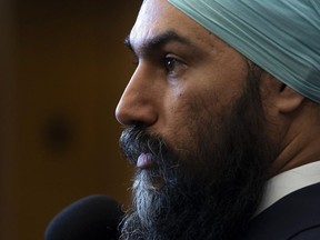 NDP Leader Jagmeet Singh speaks with reporters in the Foyer of the House of Commons during a marathon voting session Thursday March 21, 2019 in Ottawa. Singh says he decided to "take a chance" and share his story of childhood sexual abuse in hopes of helping other victims.THE CANADIAN PRESS/Adrian Wyld
