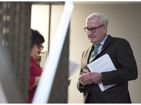 Kevin Vickers, the former House of Commons sergeant-at-arms, is briefed by Lisa Harris, left, MLA for Miramichi Bay-Neguac, before he announces his intention to run for the leadership of the New Brunswick Liberals, in Miramichi, N.B. on March 15, 2019.