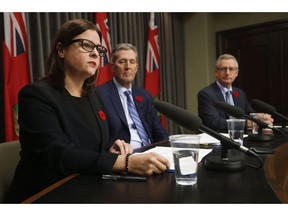 Manitoba Premier Brian Pallister, centre, and Growth, Enterprise and Trade Minister Blaine Pedersen listen in as Justice Minister Heather Stefanson talks about the Manitoba plan for cannabis retail and distribution at the Manitoba Legislature in Winnipeg on November 7, 2017. Manitoba's Progressive Conservative government is cutting a fund for welfare recipients who look for work, which will reduce benefits for some people by $25 per month. Families Minister Heather Stefanson says the province is ending the job-seekers fund brought in a decade ago by the former NDP government.