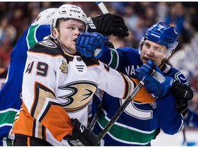 Anaheim Ducks' Max Jones, left, and Vancouver Canucks' Luke Schenn get into a scuffle during the third period of an NHL hockey game in Vancouver on February 25, 2019. Defenceman Luke Schenn has logged a lot of kilometres in the past few years. The former fifth-overall pick at the 2008 NHL draft has with the Arizona Coyotes, Anaheim Ducks and Vancouver Canucks over the past three seasons, and spent time with all of the teams' American Hockey League affiliates. The Ducks dealt Schenn to the Canucks in February and the 29-year-old made the most of his latest opportunity, carving out a much-needed niche as a physical blueliner who could compliment and protect the Canucks young talent.