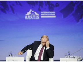 Russian President Vladimir Putin gestures as he attends a plenary session of the International Arctic Forum in St. Petersburg, Russia on April 9, 2019. A House of Commons committee is urging the government to work with NATO to determine Russia's true military intentions in the North in order to protect the country's Arctic sovereignty. That's the top recommendation of a report tabled today by the Commons foreign affairs and international development committee based on a study it began last June. Its release comes one day after Russian President Vladimir Putin outlined an ambitious plan to increase Russia's Arctic presence, including expanding its fleet of nuclear-powered ice breakers and building new ports and other infrastructure.