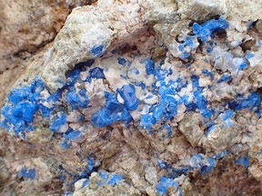 Vivid blue spinel with white carbonate in calc-silicate rock is seen in this undated handout photo. Baffin Island holds some of its treasure in plain sight with rocks that produce rare gems sitting exposed to the elements, scientists say. A new study from the University of British Columbia shows the area is home to a mineral that is prized by jewellers and collectors. Study co-author Philippe Belley said in an interview that cobalt-blue spinel, "which is a ridiculously rare gemstone" gets a lot of interest from gemologists and jewellers but there's not enough supply.