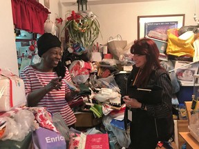 Yvonne Zilber, left, speaks with Trudy Huet of VHA Home HealthCare and Chair of The Hoarding Support Services Network in Zilber's Toronto home in this undated handout photo. From within the walls of her two-bedroom apartment in Toronto, Yvonne Zilber has produced enough material to fully furnish two houses. Giving old possessions to family and friends has allowed her to reduce the piles of belongings that once obscured her living room window, but has not yet allowed the retired teacher to dispense with the label she long resisted accepting - hoarder.