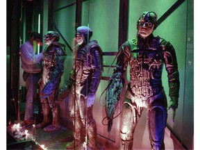 A worker puts the finishing touches on a display of Borgs, which lines the walls at Star Trek: The Experience, at the Las Vegas Hilton on January 2, 1998, in Las Vegas. A lawyer representing Manitoba says a "Star Trek" fan wasn't allowed to keep his personalized ASIMIL8 licence plate because the word cannot be removed from the history of forced assimilation of Indigenous people in the province. Manitoba Justice lawyer Charles Murray told a Winnipeg court Monday that licence plates are owned and issued by Manitoba Public Insurance, and the insurer cannot be divorced from a historical context of "cultural genocide." Assimilate, whether in the context of a fictional alien race or the real history of Indigenous people in Canada, is "talking about wiping out the uniqueness of people," Murray said.